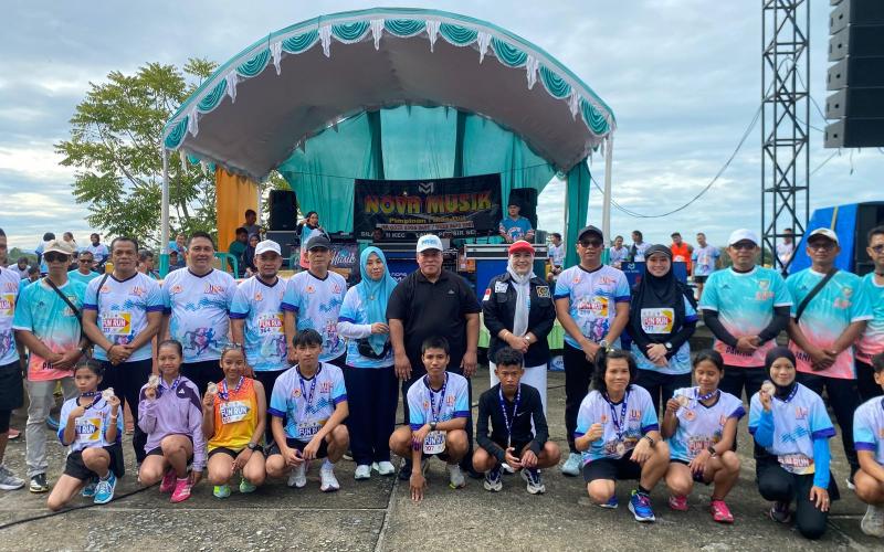 Kapolres Mukomuko Bersama Ketua Bhayangkari Hadiri dan Ikuti Fun Run 5K KONI Mukomuko serta Penebaran Benih Ikan di Danau Nibung