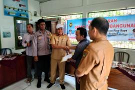 Bhabinkamtibmas Polsek Pino Raya Hadiri Serah Terima Pembangunan Gedung PAUD di Desa Telaga Dalam